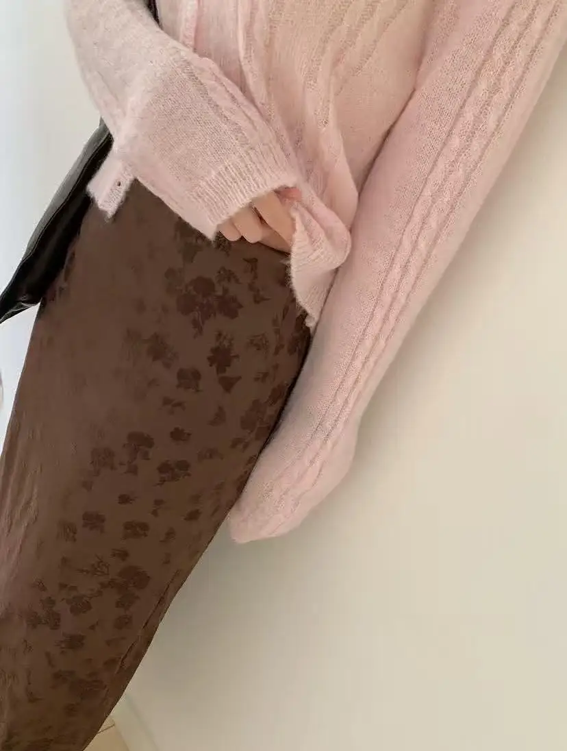 Long sleeved knitted cardigan with Korean style sweet atmosphere, Korean version loose and gentle style, and hollowed out style