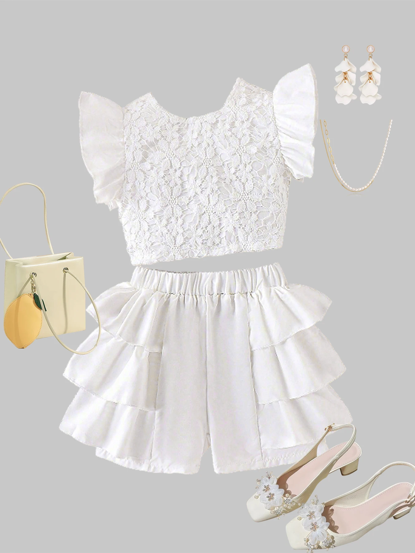 

Весенне-летняя мода для девочек: изысканный топ с ажурными рукавами-крылышками + шорты с многослойными оборками