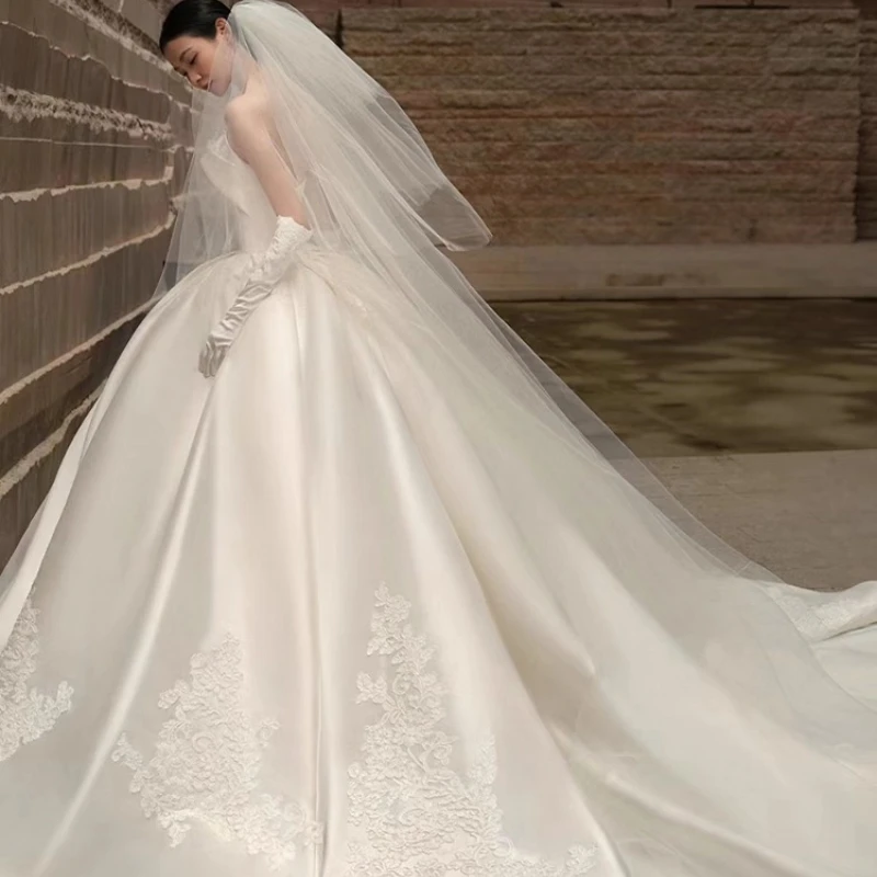 Custom Floor To Ceiling Large Trailing Bridal Gown with Strapless Satin and Lace Embroidery for The Bride's Main Wedding Dress