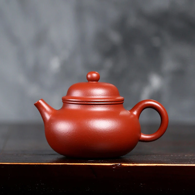 

Manual palace lamp pot strength Huanglongshan raw mineral red mud Dahongpao Yixing purple clay teapot teapot tea set