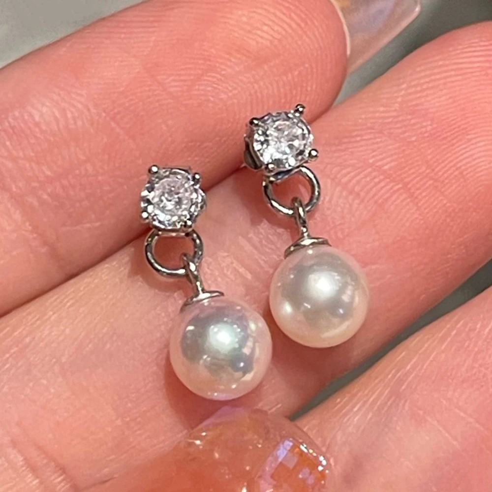 

Серьги-гвоздики из стерлингового серебра 925 пробы с двусторонним дизайном и белым круглым натуральным жемчугом диаметром 6-7 мм для повседневного ношения и элегантных мероприятий