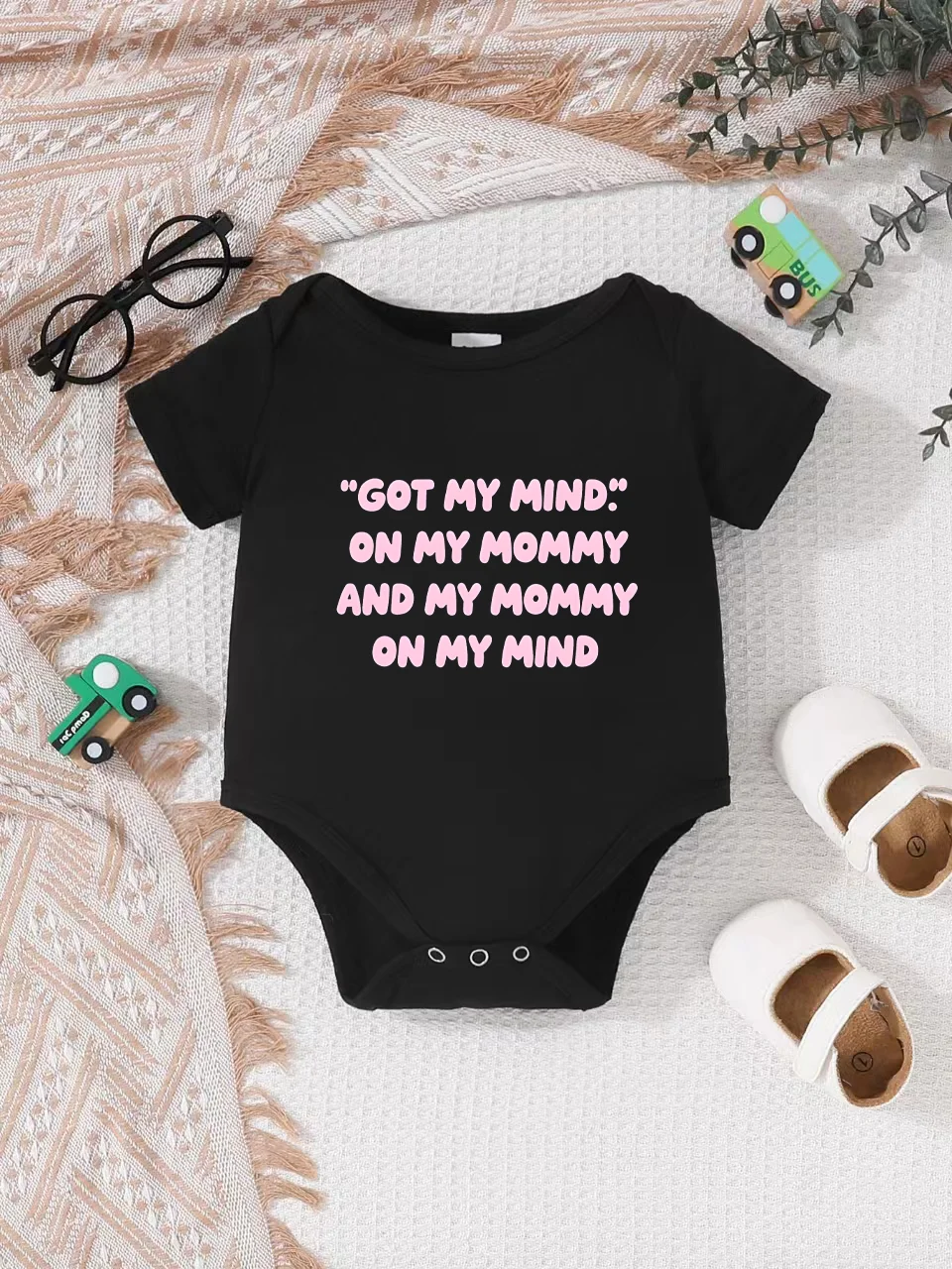 

Playful letter-printed baby short-sleeve triangle bodysuit. Button closure for easy dressing