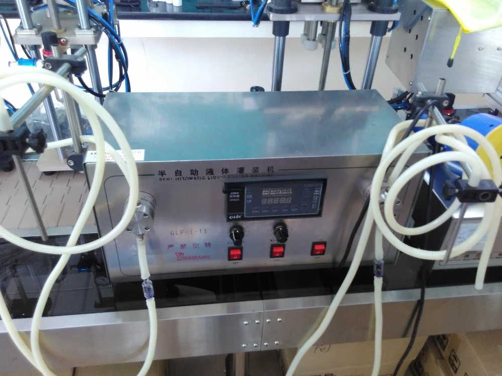 Selling best small portable semi automatic desktop 1/2 heads vials liquid filling machine