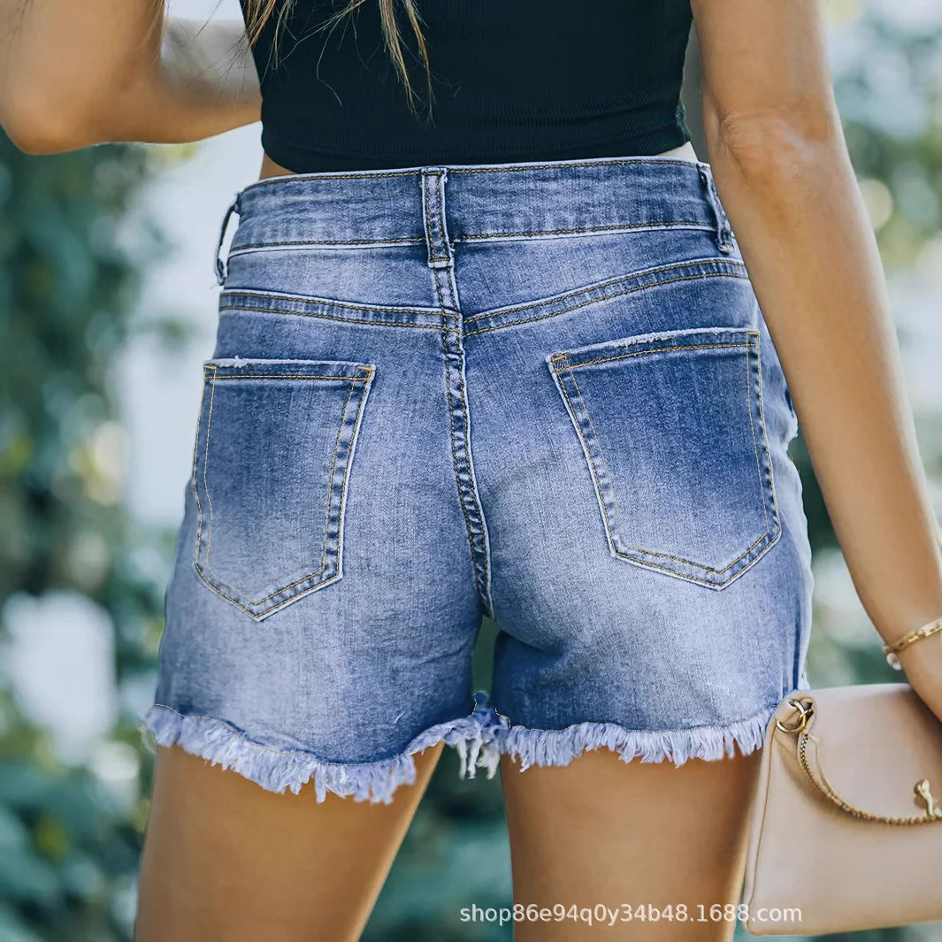 أوروبا أمريكا الجديدة غسلها ممزق الدينيم السراويل. شورت فضفاض كاجوال بتصميم شرابة عصري ومتعدد الاستخدامات للنساء في الصيف