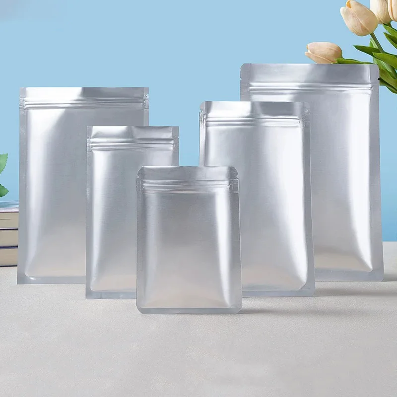 

Silver Three Side Seal Ziplock Vacuum Foil Bags Food Storage Mylar Bags Frozen Food Packaging Bags Powder Nuts Packaging Bags