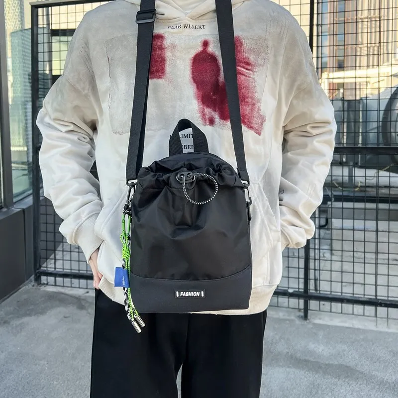 

Trendy brand sports crossbody bag, women's outdoor drawstring bucket small bag, men's 2025 new lightweight mobile phone bag