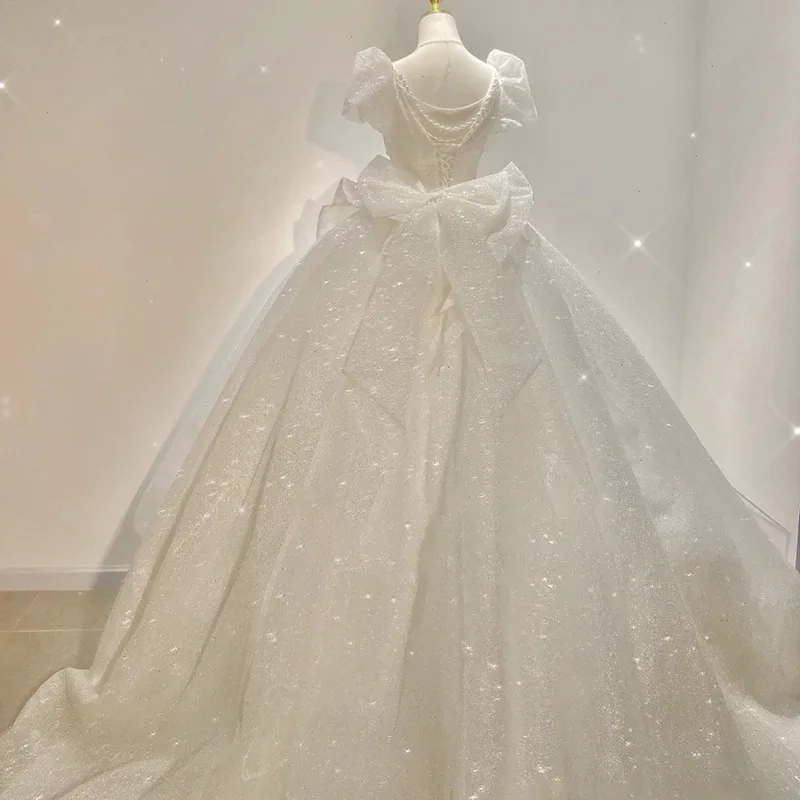 Vestido De novia De princesa con lentejuelas y perlas De manga corta, vestidos De novia con lazo grande, corsé con cordones, Vestido De novia sin espalda