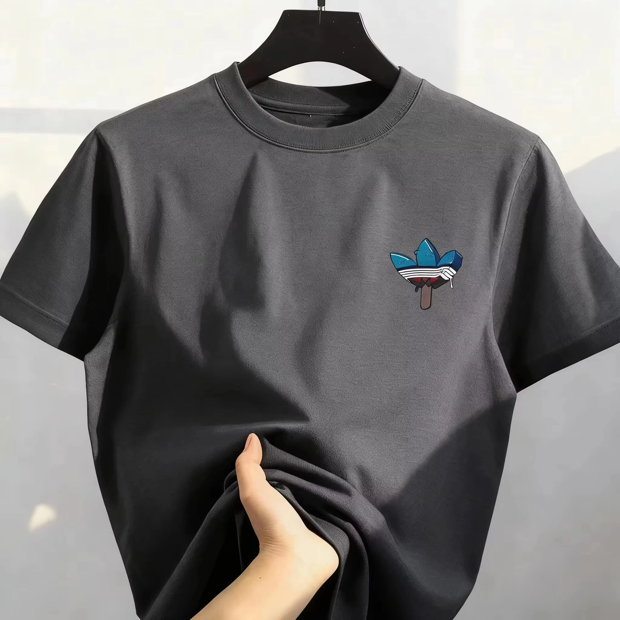 2026 Neues Bestseller Koreanisches Streetwear T-Shirt aus Reiner Baumwolle mit Cartoon-Print, Rundhals, Bequem und Locker, für Herren und Damen
