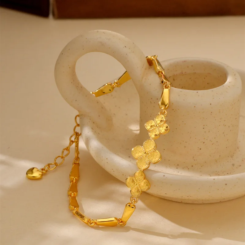 

Autumn and winter high-end zodiac year 24K real gold shiny gold four-leaf clover snake bone 9999 bracelet hand jewelry