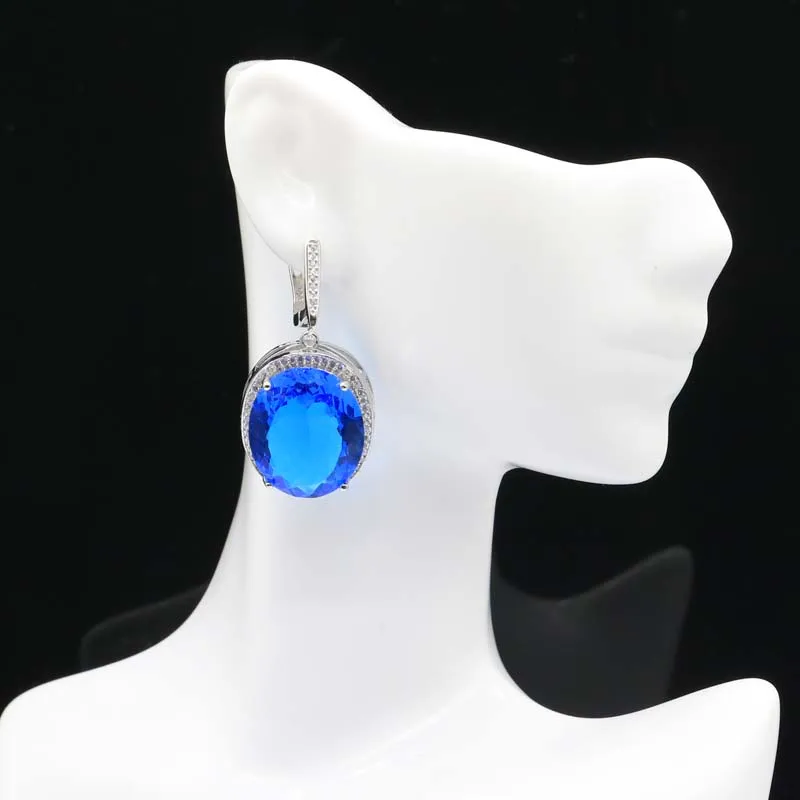 ต่างหูเงินประดับพลอยแทนซาไนต์สีม่วงขนาด 40x21 มม. ตัดละเอียดประณีต น้ำหนัก 17.5 กรัม เหมาะสำหรับผู้หญิง