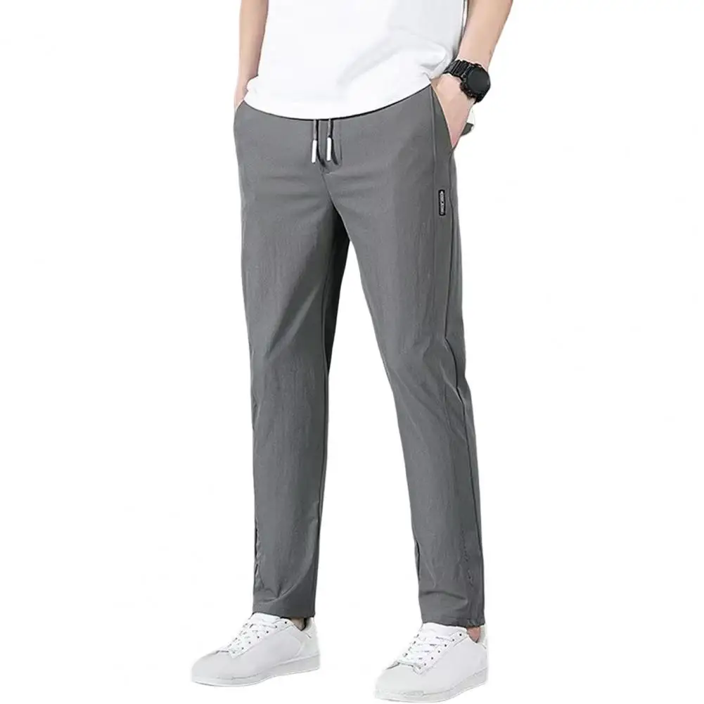 Celana olahraga pria, celana kasual pria Ice Silk 2024, warna Solid, celana Sweatpants kaki lurus bersirkulasi elastis luar ruangan
