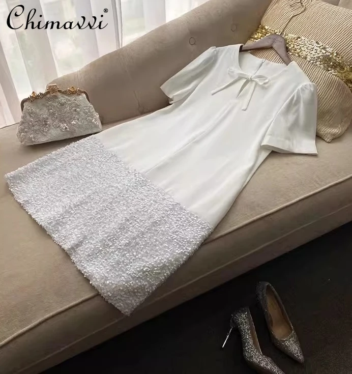 Station européenne été nouveau haut de gamme léger luxe célébrité tempérament nœud ample robe courte lourd paillettes fête robe droite