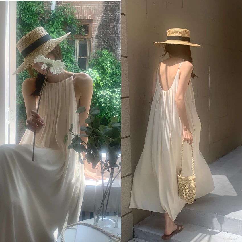 

Clothland Women Sweet Backless Pleated Dress Sleeveless Pleated White Black Casual Beach Summer Midi Dresses Mujer QD926