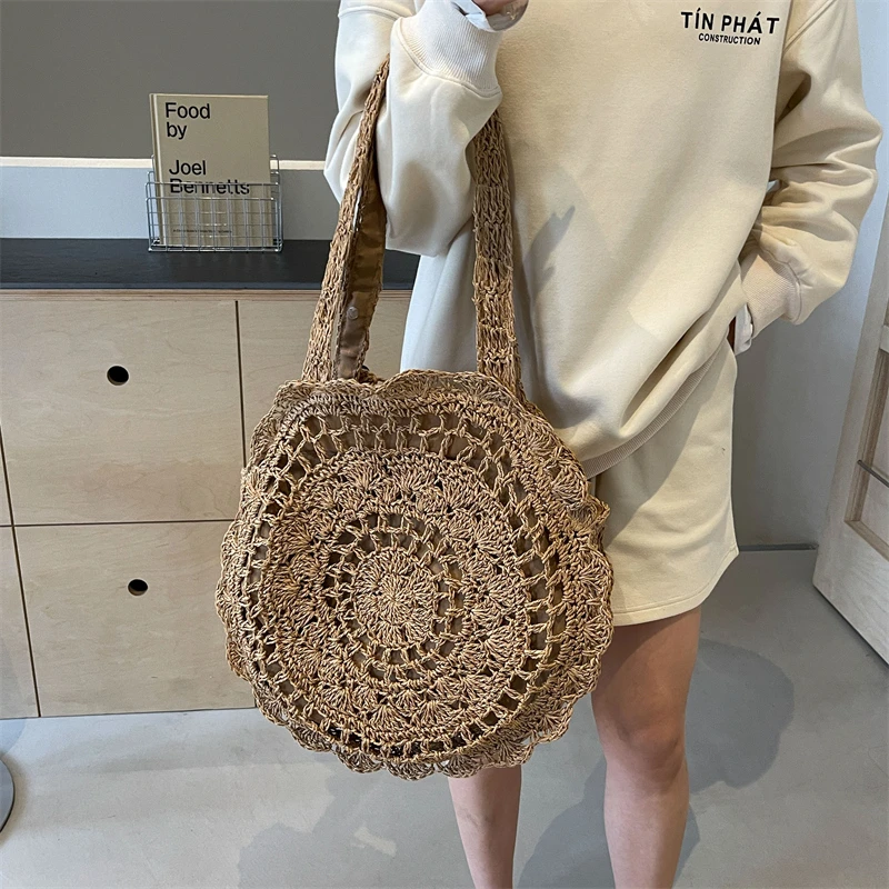 

2024 new summer style fashion ring large capacity women's shoulder bag hot-selling beach vacation style hollow straw bag Bolsa