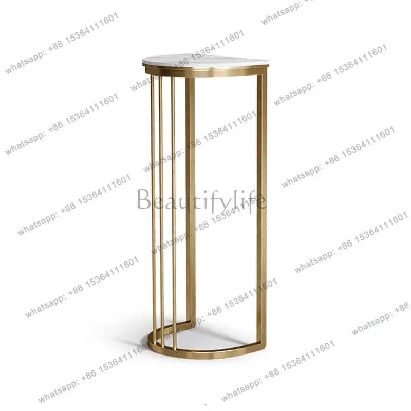 

Simple and modern stainless steel flower stand, shelf, creative floor-to-ceiling rock slab next to the TV cabinet