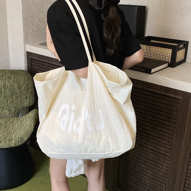 

Модная женская сумка через плечо, нейлоновые сумки для девочек, новинка 2023 года, большая студенческая ткань с буквами, сумки для покупок, сумки для книг, тканевые сумки для девочек Bolsas