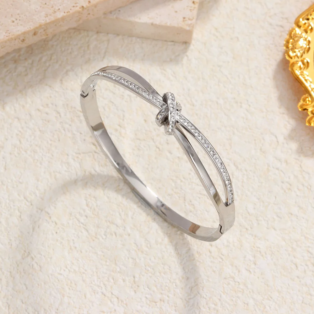 

Women's men's stainless steel 18K bracelet, simple knotted and sticky design waterproof jewelry, trendy and high-end