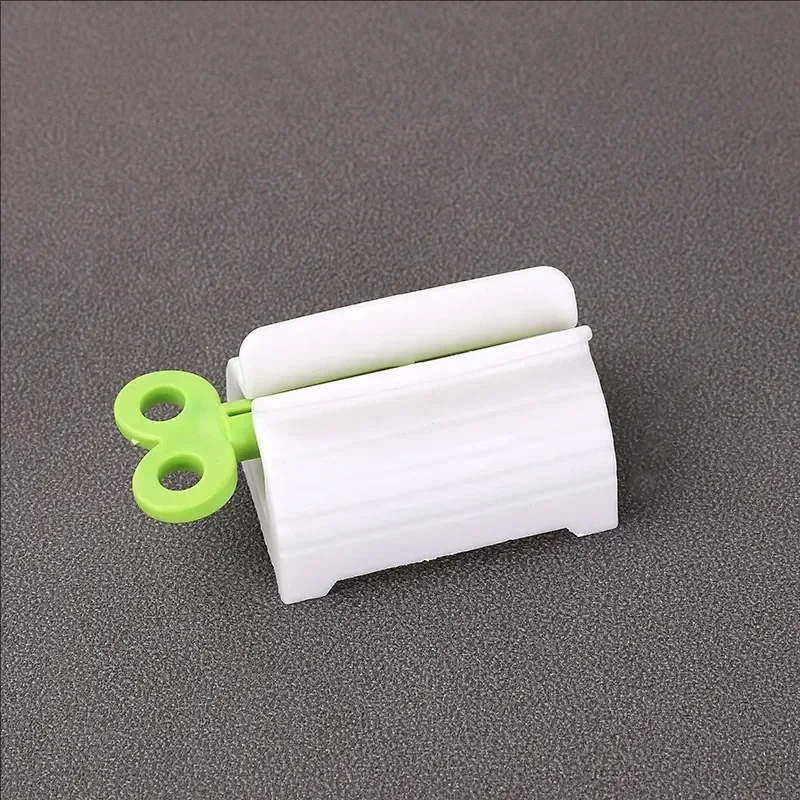 1 Pc Rolling Tube Toothpaste Squeezer Toothpaste Seat Holder Stand Rotate Toothpaste Dispenser for Bathroom