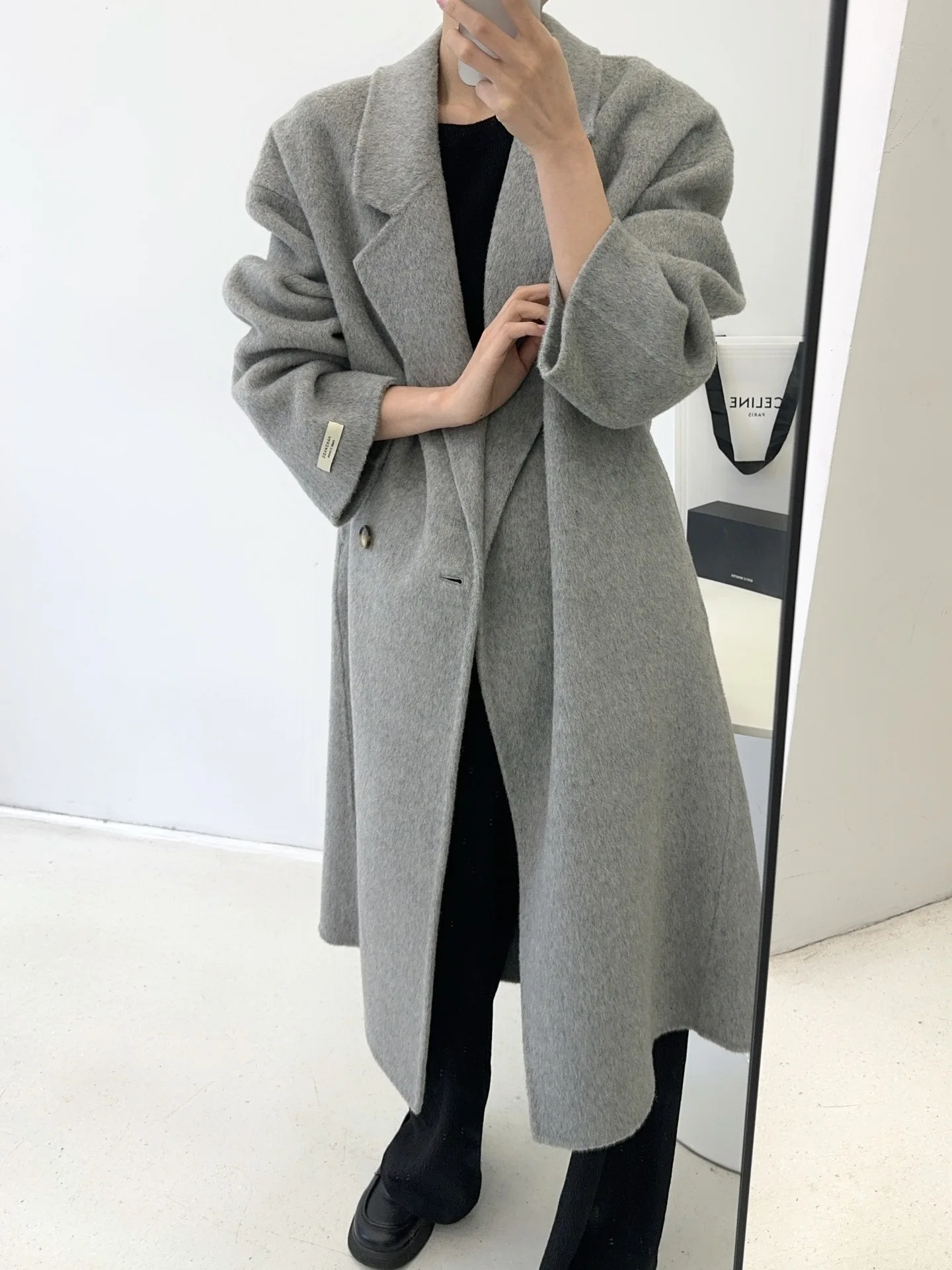 Autumn and winter women\'s casual solid color lapel long sleeved loose long coat