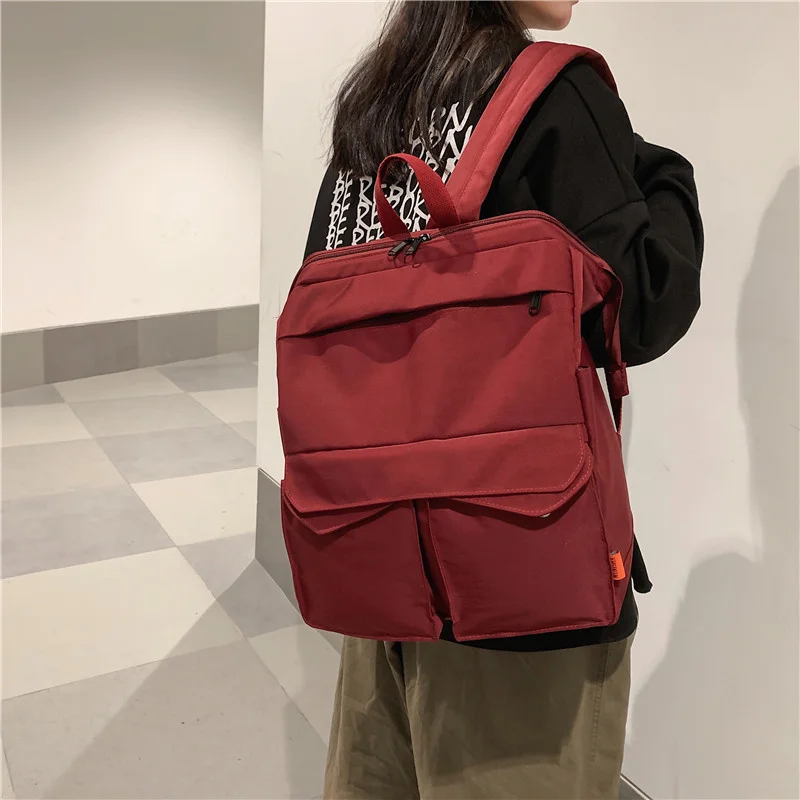 

Hong Schoolbag female Kong nylon canvas backpack large-capacity leisure Korean high school students solid color