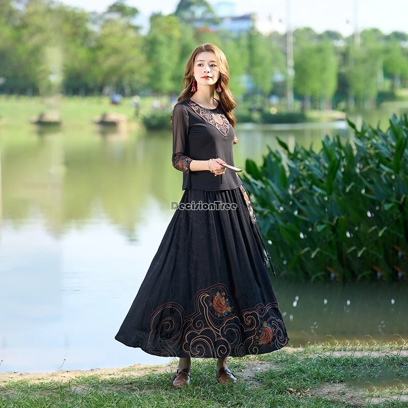 تنورة كلاسيكية صينية متوسطة الطول لعام 2025 بخصر مطاطي فضفاض على الطراز العرقي تنورة على شكل حرف a مطرزة بحاشية كبيرة تنورة نصف غير رسمية للنساء t1