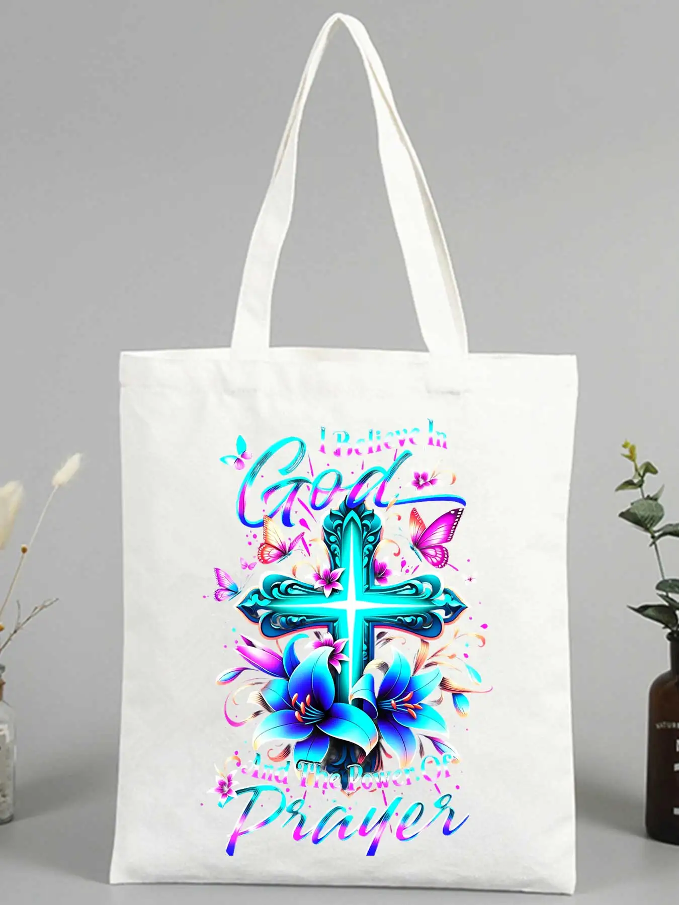canvas tote bag with cross, butterfly and floral print, ideal for casual daily use and church outings