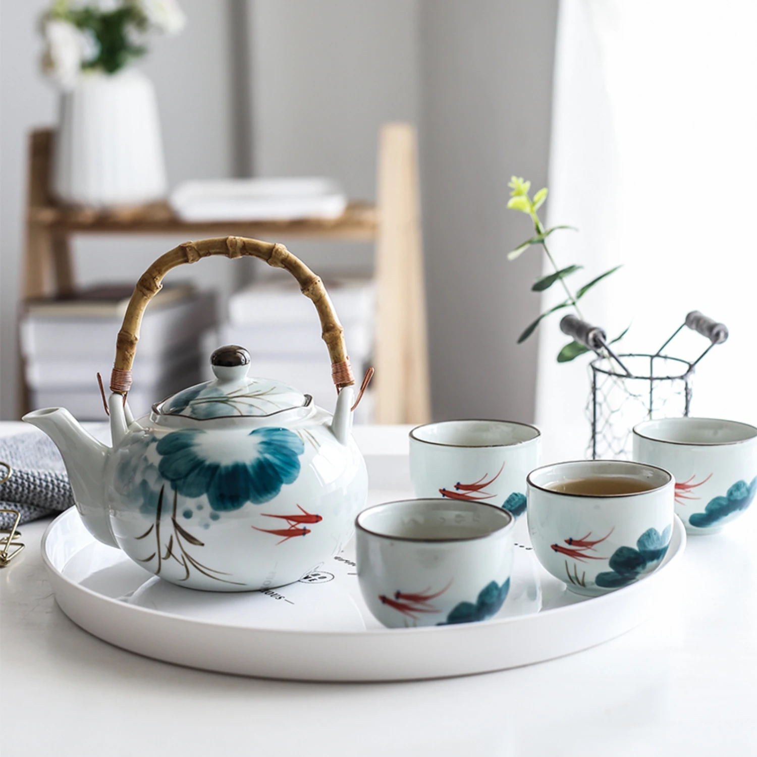 Indulge in a luxurious tea time experience with this exquisite Ceramic Lotus Goldfish Tea Kettle Set - Elevate your home decor w