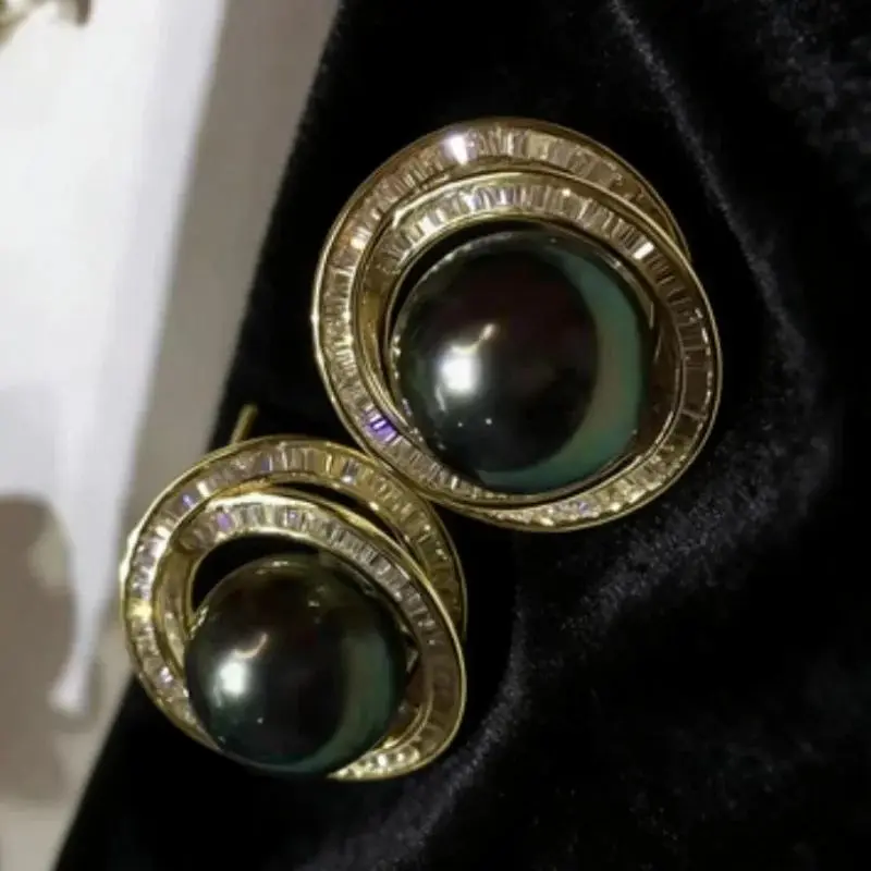 Fashionable pair of AAAAA 11-12mm natural South Sea round black green pearl earrings 925s