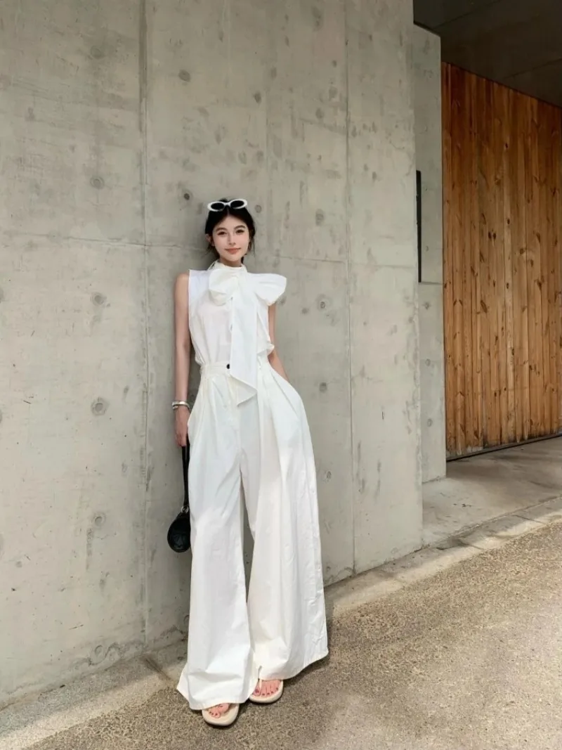 

Комплект одежды во французском стиле для женщин: блузка без рукавов с бантом-бабочкой, брюки с высокой талией и широкими штанинами, элегантный комплект из 2 предметов. ​