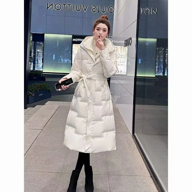

Женская хлопковая стеганая куртка с капюшоном и поясом, женское хлопковое пальто, новинка 2025, модное корейское свободное длинное парковое пальто, женская верхняя одежда