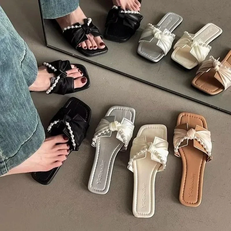 

Retro Fashion Versatile Flat Sandals for Women2026Spring and summer new fashion bowknot slide sandals with pearls
