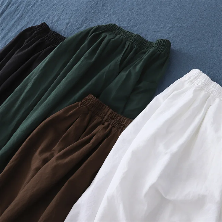 A/W stone-washed linen harem pants with an elastic waist and cropped ankle length for a relaxed fit.