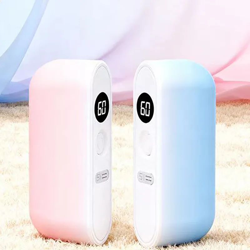 Split style hand warmer with magnetic suction and LCD display for temperature independent heating, changing from one to two view 2