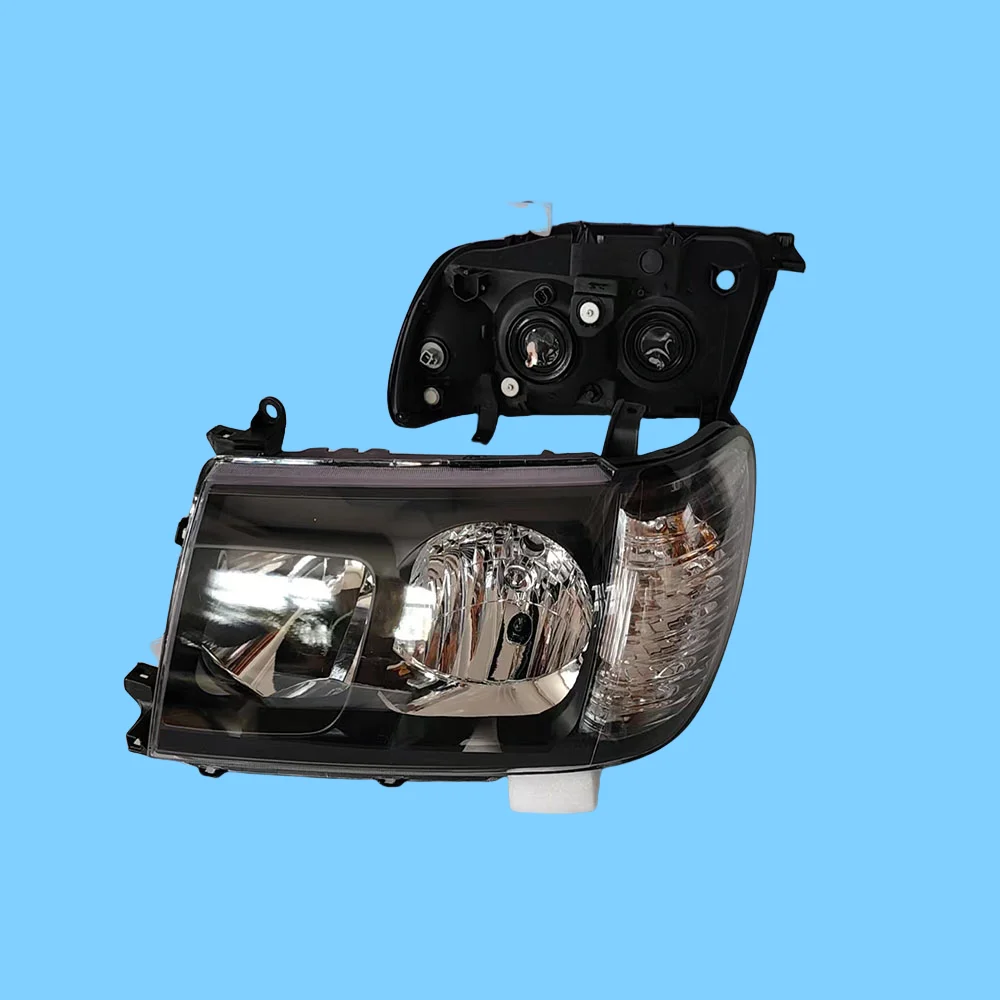 A pair of black headlights specifically designed for the Land Cruiser LC100 FJ100 2005-2007 model - Image 5