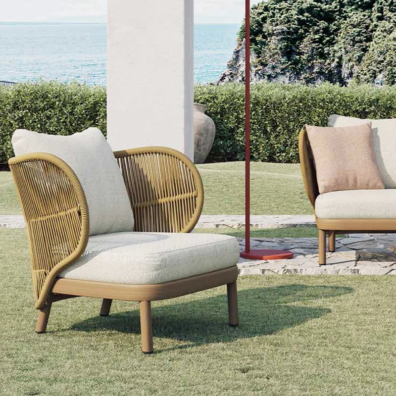Modern outdoor patio sofa and chair set, woven with rattan, designed to be durable and weather-resistant, suitable for courtyard