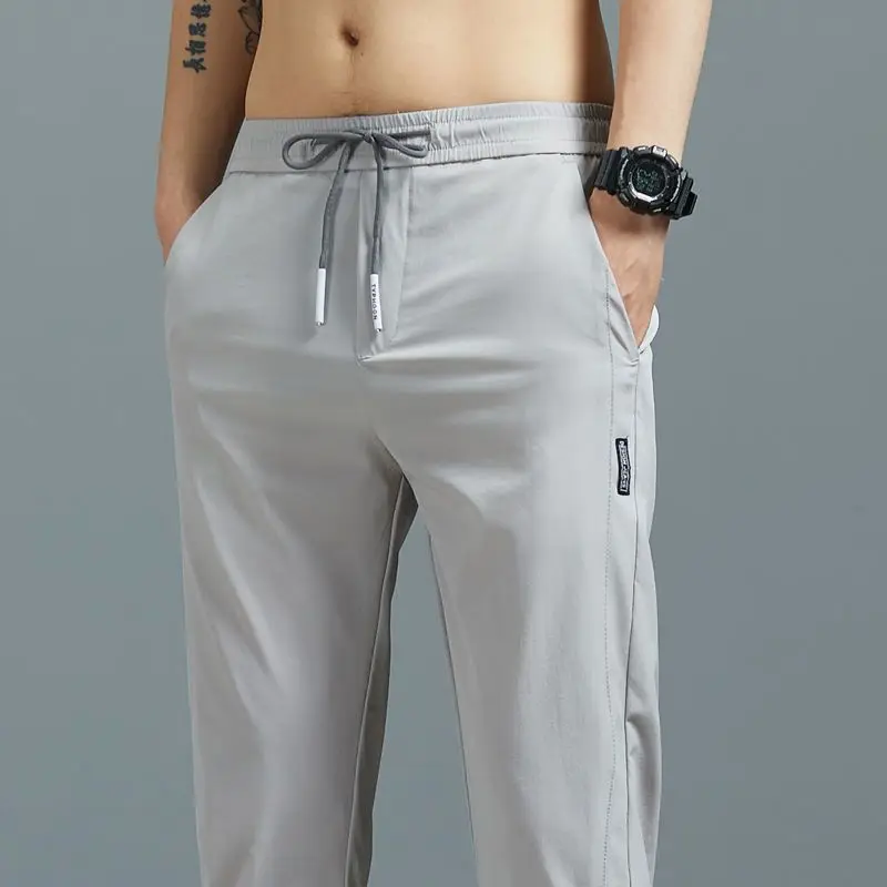 Calça casual masculina de Stretch Joggers, moletom sedoso solto, ginástica ao ar livre, marca de verão, masculina