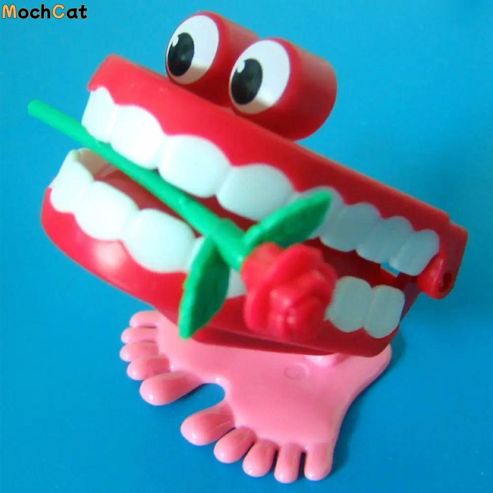 Simpatico plastica per protesi per bambini, denti che camminano a forma di carica, denti a orologeria, rosa a orologeria