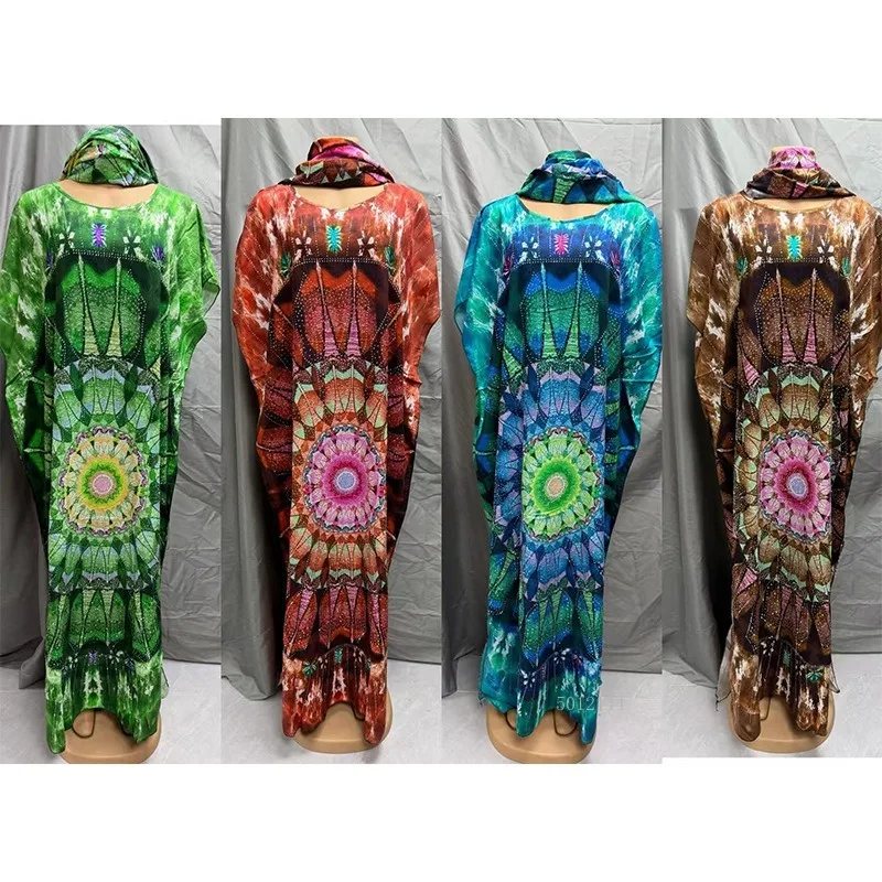 2026 Modieuze Afrikaanse vrouwen jurk rayon positionering hot boren afdrukken losse strand jumpsuit lange jurk groot formaat gewaad
