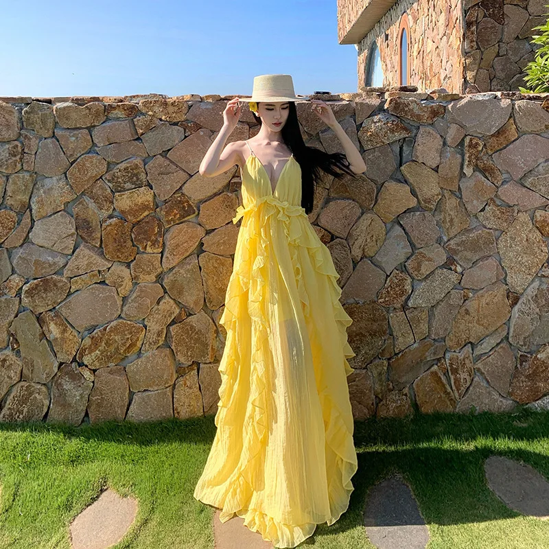 Seaside Vacation Dress Women's Summer 2026 New Celebrity Temperament Suspender Backless Yellow Skirt High Value Age Reduction