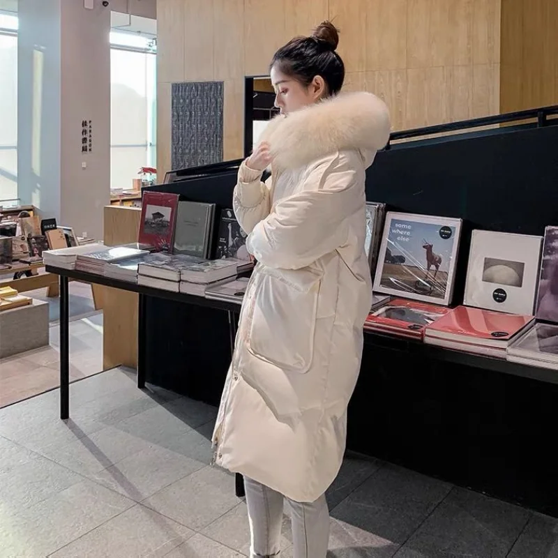 Chaqueta de plumón de pato blanco para mujer, abrigo térmico grueso hasta la rodilla, última moda coreana para estudiantes, invierno, 2023