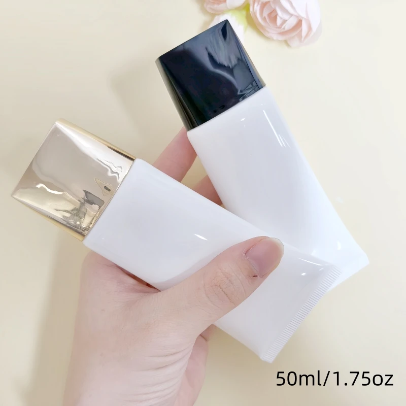 6 ชิ้น 50 กรัม บรรจุภัณฑ์สกินแคร์แบบหลอดเปล่าทรงแบน สีดำทอง ฝาปิดทรงแบนสีขาว ทรงแบนรูปไข่  ขายตรงจากโรงงาน