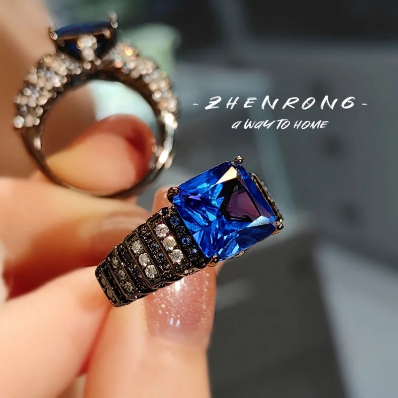 

Retro black gold colored gemstone red corundum ring. Luxurious angel wings blue quartz women's ring. Women's engagement jewelry.