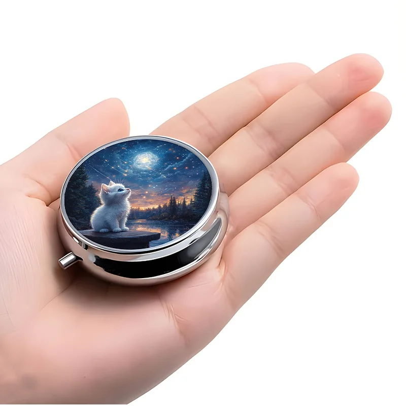 A Small Pill Box Divided into Three Sections, Decorated with a Charming Cat Gazing at the Stars, the Reflection of a Lake, and the Outline of a Forest. This Decorative Metal Box Is Perfect for Carrying Medications and Vitamins, Especially during Travel or for Daily Use.