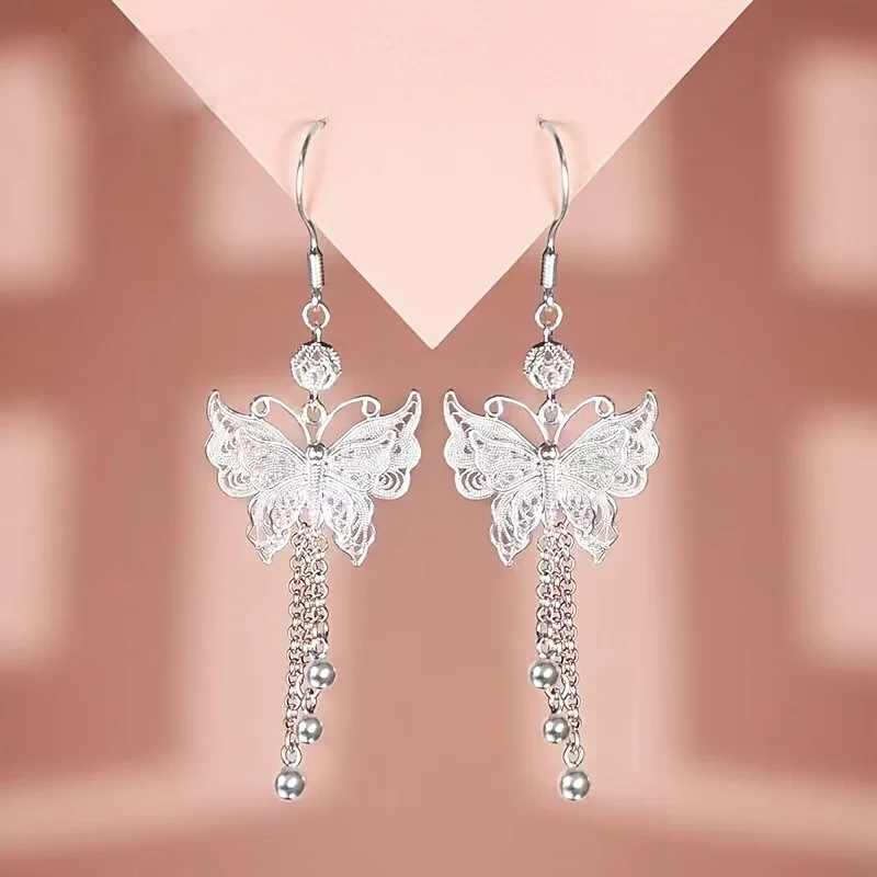 

S925 sterling silver elegant butterfly hollow flower chain tassel earrings, minimalist art style, suitable for all seasons, a la