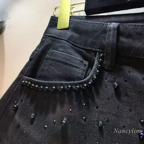 Imagen 2 del producto Pantalones vaqueros de encaje huecos europeos 2025, novedad de verano para mujer, pantalones vaqueros de encaje negro, cuentas industriales pesadas, mezclilla de diamante caliente, empalme de ganchillo