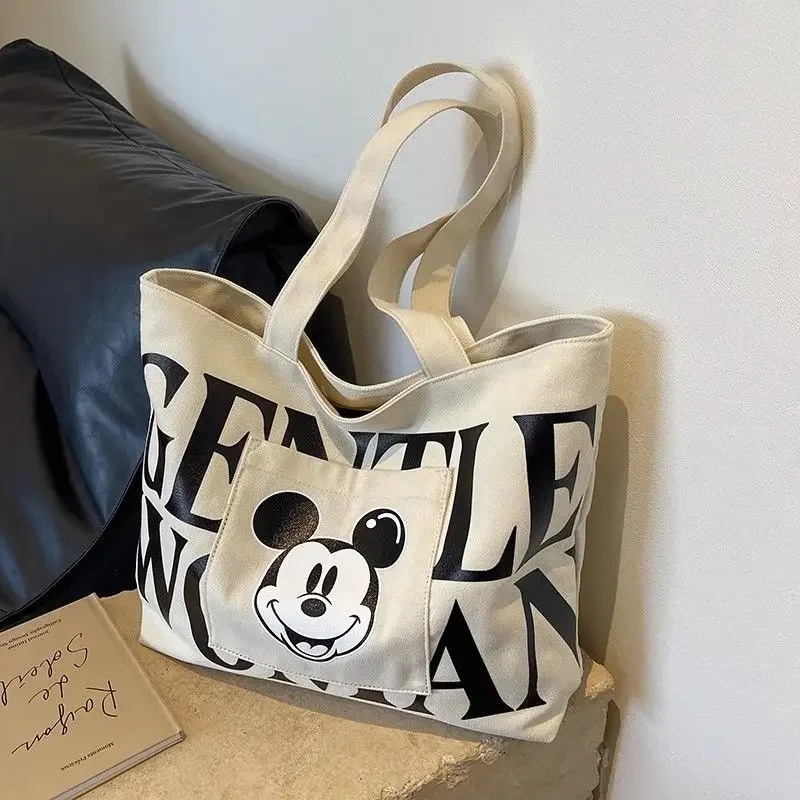 Disney 2025 New Mickey Large Capacity Canvas Bag Female Cartoon Versatile Shoulder Bag Student Class Commuting Tote Bag