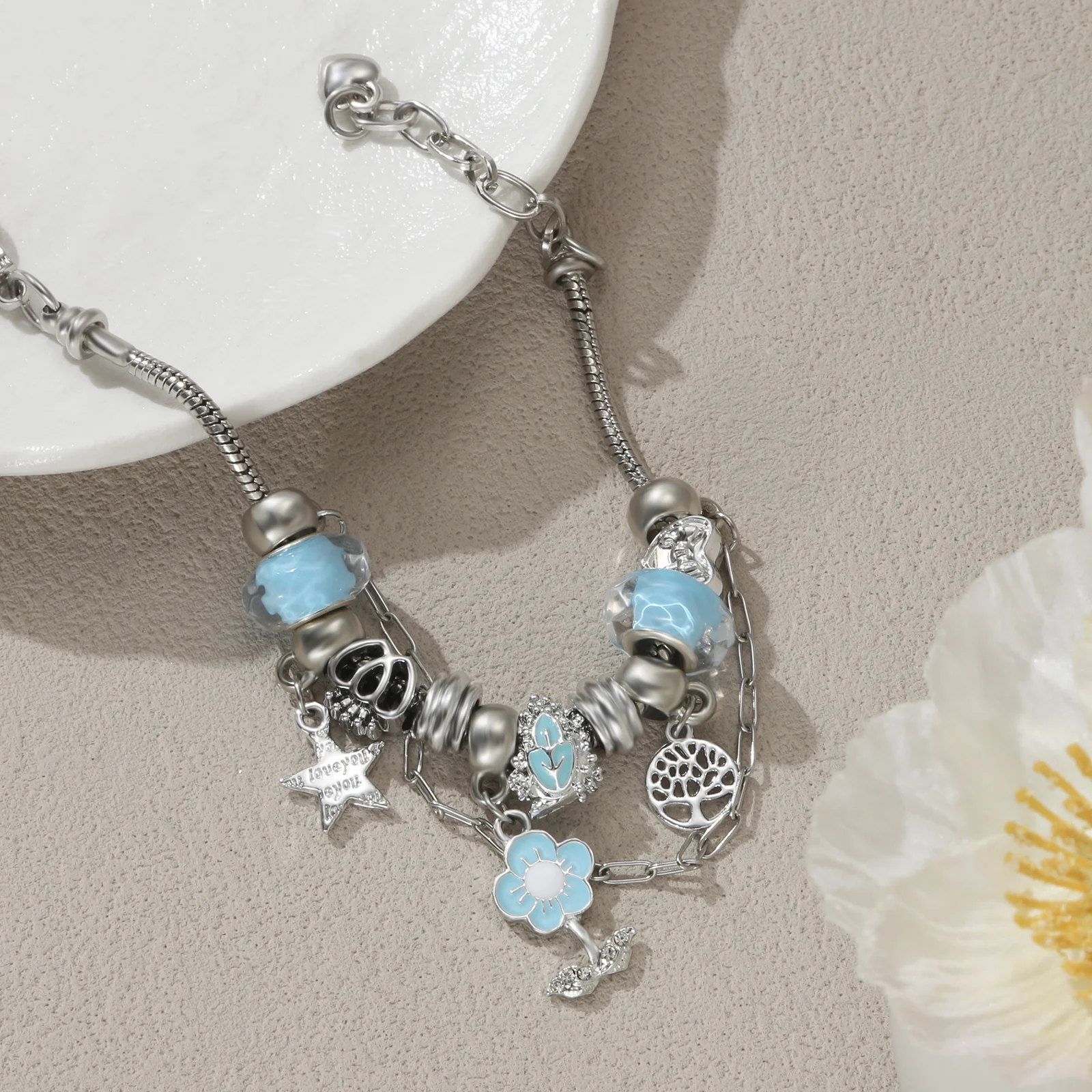 

Silver Tone Charm Bracelet with Blue Flower and Tree of Life Pendant for Women