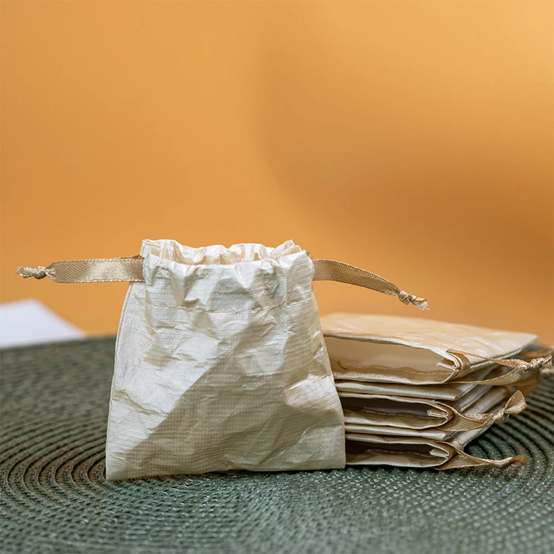 

5pcs/set Waterproof Kraft Paper Drawstring Jewelry Pouches Champagne Color Gift Bags for Earrings Bracelets Wholesale Packaging