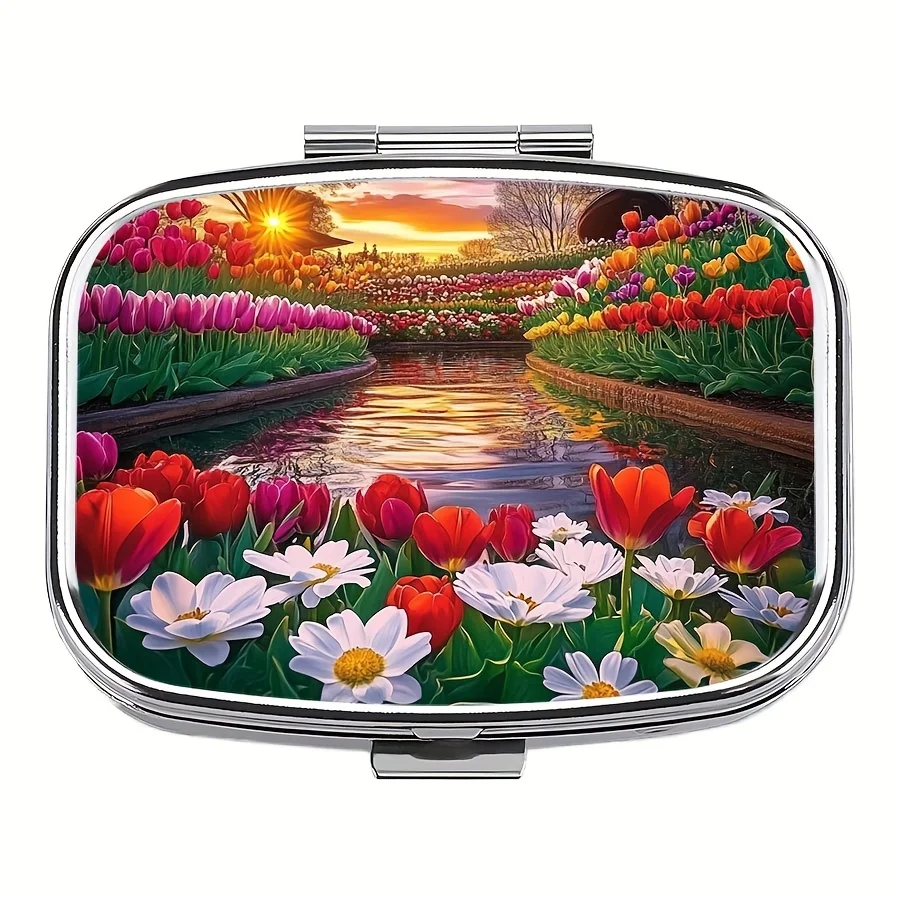 A compact pill organizer with two compartments, featuring a colorful tulip and daisy design, is perfect for travel and makes a unique gift idea. It has a sunset landscape design and is made of durable plastic
