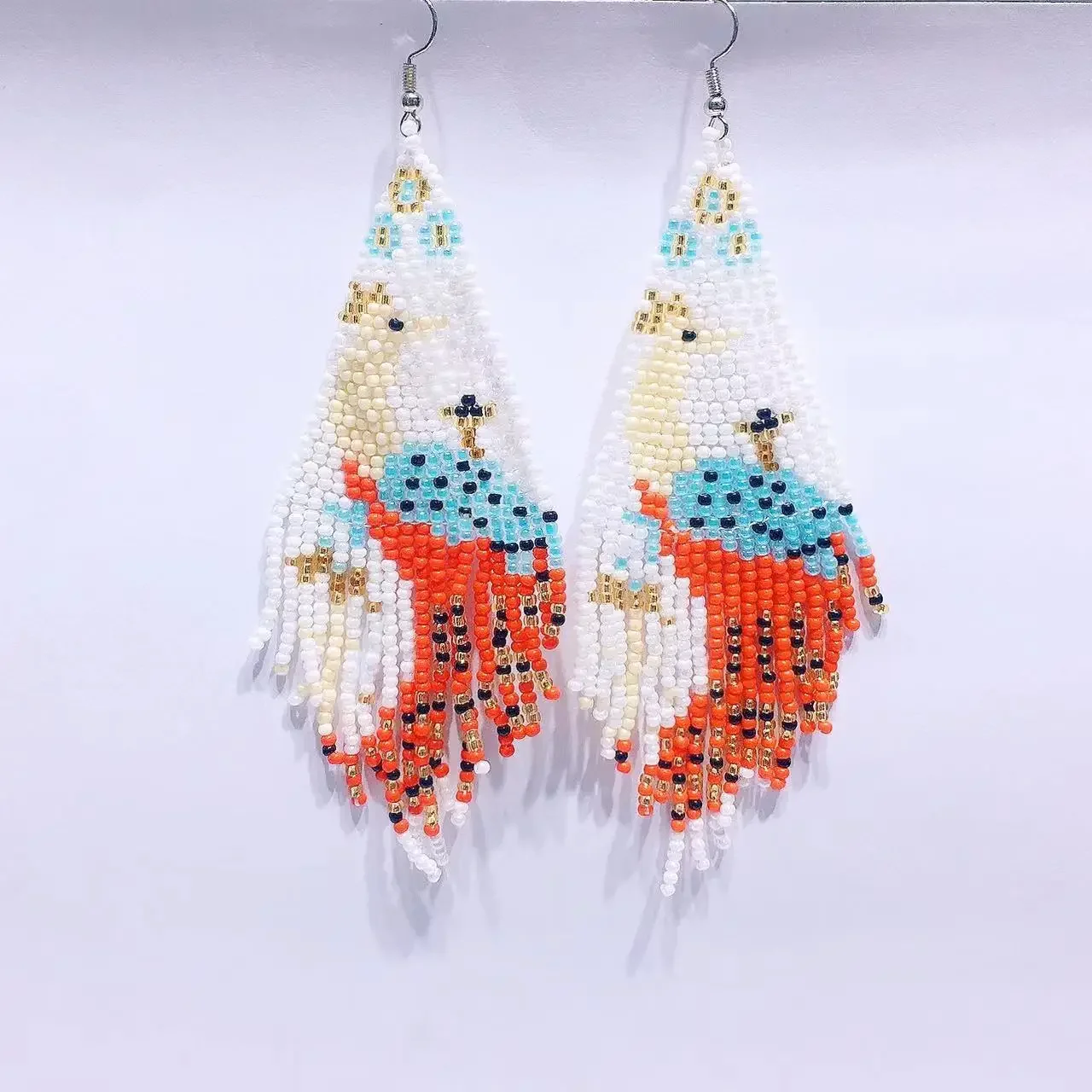 

Fringe Earrings Hand knitting Bohemia fashion ostrich Beading personality originality alloy ma'am Rice Bead Earrings